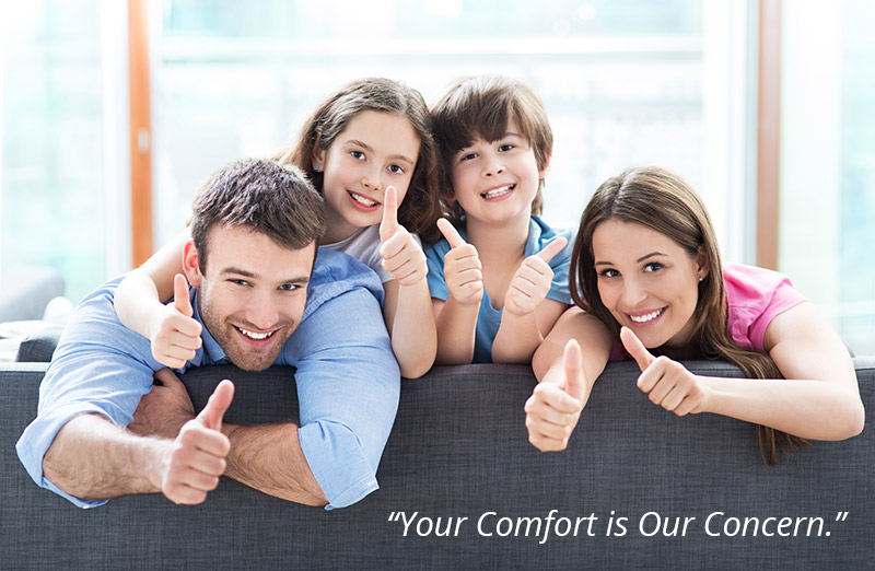 Estes Heating & Air Conditioning family giving thumbs up